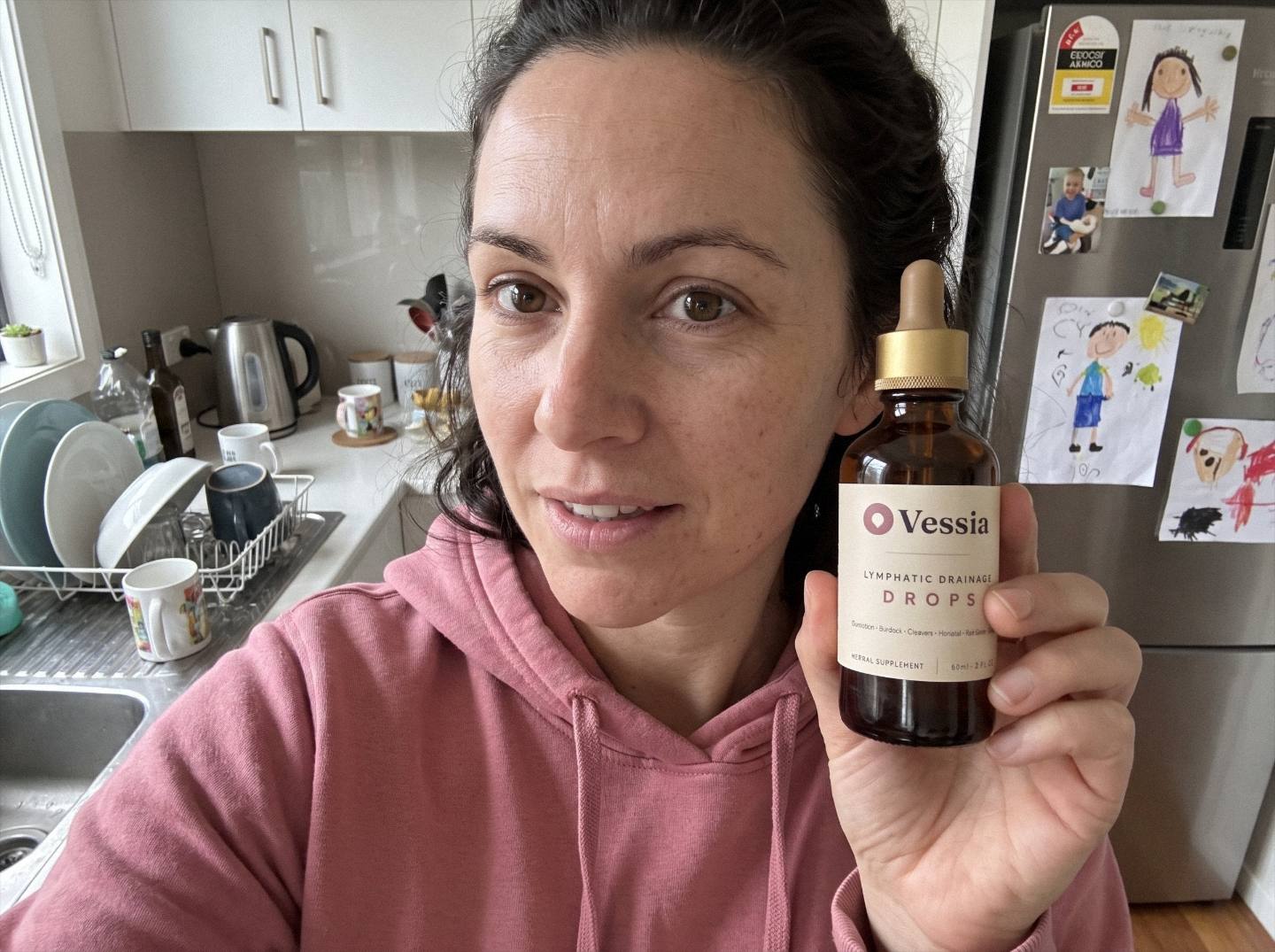 Chloe M. holding Vessia Lymphatic Drainage Drops