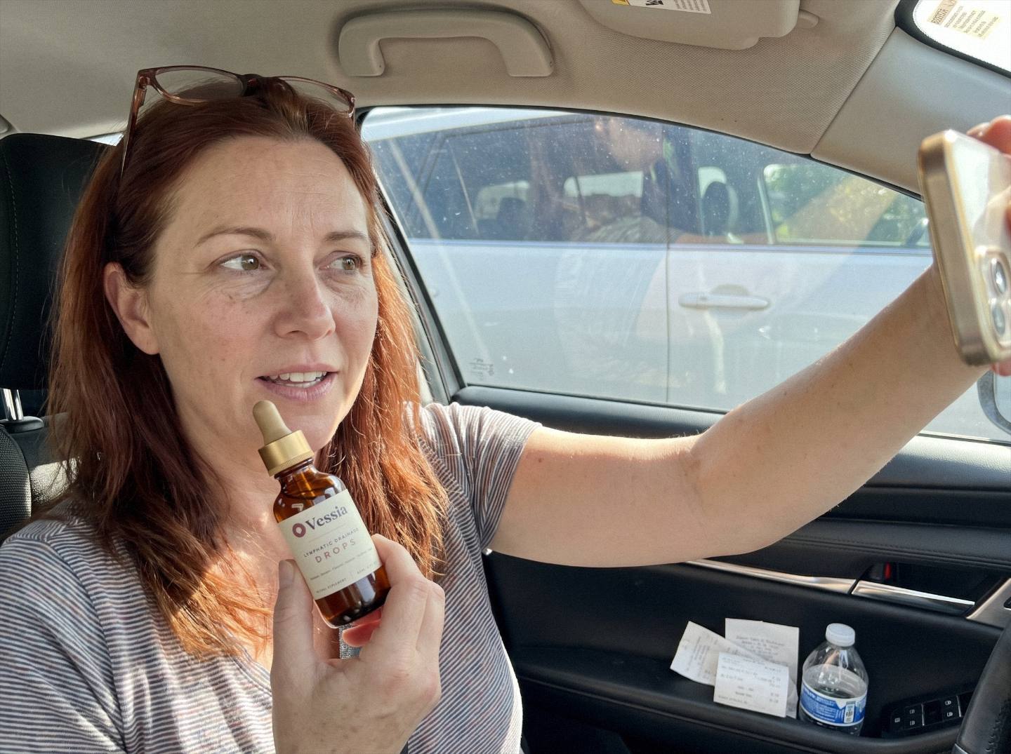 Renee T. holding Vessia Lymphatic Drainage Drops